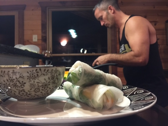 Joe rolling together the mango, avocado, and rice spring rolls